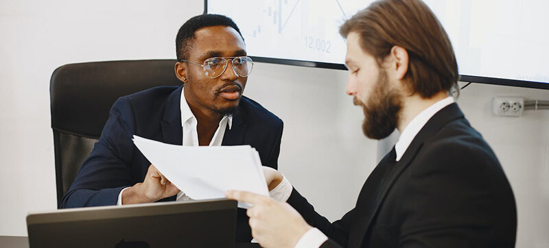Coworkers reviewing business documents